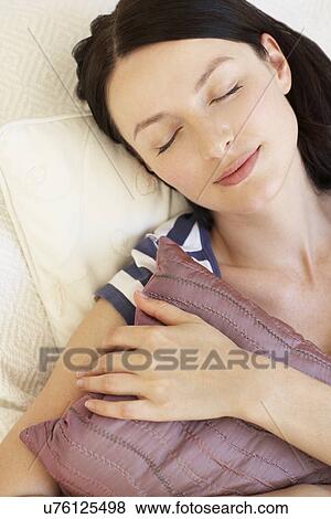 Woman resting at home View Large Photo Image Stock Photo - Woman resting at home. Fotosearch