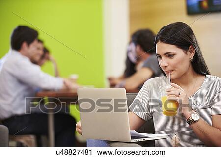 Woman Sitting On Sofa And Working In Design Studio View Large Photo Image Stock Image - Woman Sitting On Sofa And Working In Design Studio . Fotosearch