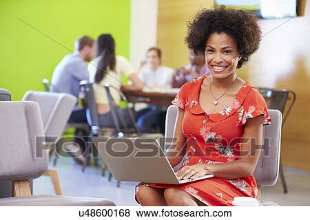 Stock Photo - Woman Taking A Break Working In Design Studio . Fotosearch