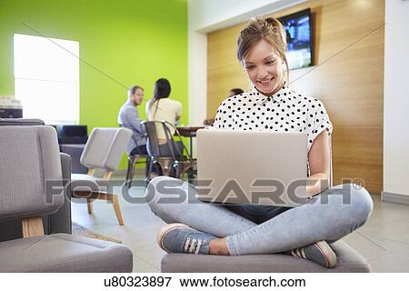 Stock Photo - Woman Taking A Break Working In Design Studio . Fotosearch