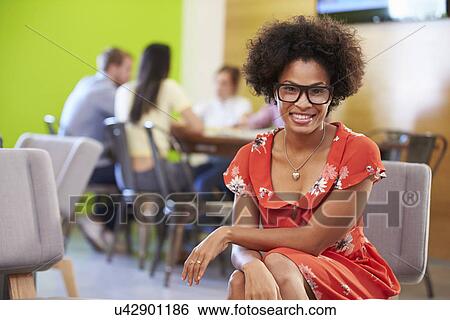 Stock Photograph - Woman Taking A Break Working In Design Studio . Fotosearch