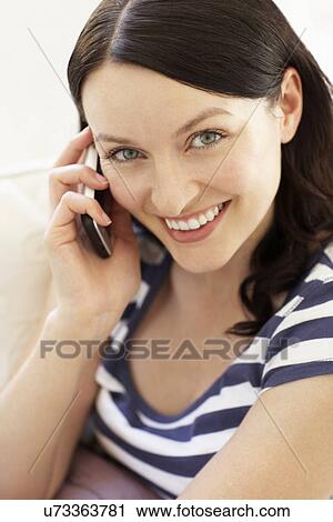 Woman talking on phone View Large Photo Image Stock Image - Woman talking on phone. Fotosearch