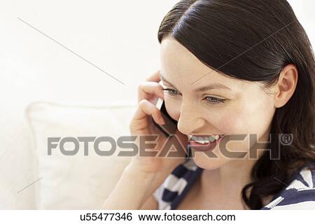 Woman talking on phone View Large Photo Image Stock Photograph - Woman talking on phone. Fotosearch