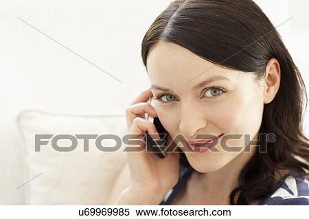 Stock Photography - Woman talking on phone. Fotosearch