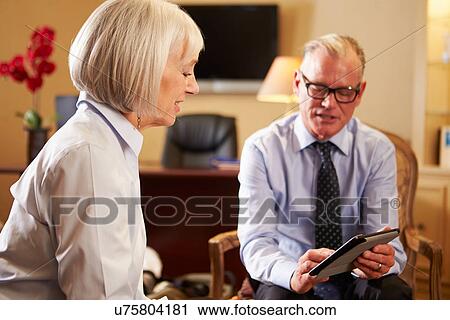 Woman Talking To Male Counsellor Using Digital Tablet View Large Photo Image Stock Image - Woman Talking To Male Counsellor Using Digital Tablet. Fotosearch