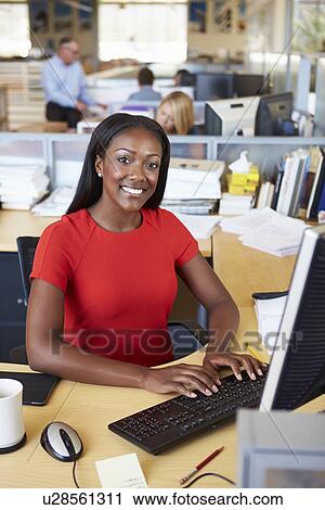 Woman Working At Computer In Modern Office View Large Photo Image Stock Image - Woman Working At Computer In Modern Office. Fotosearch