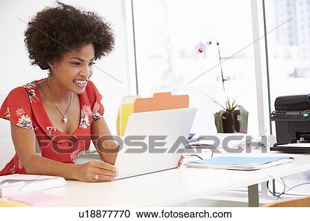Woman Working At Desk In Design Studio View Large Photo Image Stock Image - Woman Working At Desk In Design Studio . Fotosearch