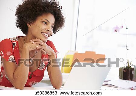 Woman Working At Desk In Design Studio View Large Photo Image Stock Image - Woman Working At Desk In Design Studio . Fotosearch