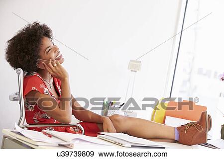 Woman Working At Desk In Design Studio View Large Photo Image Stock Photo - Woman Working At Desk In Design Studio . Fotosearch