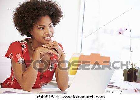 Woman Working At Desk In Design Studio View Large Photo Image Stock Photo - Woman Working At Desk In Design Studio . Fotosearch