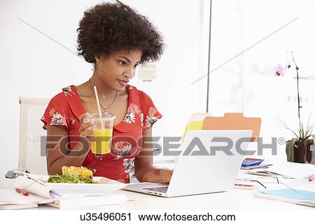 Woman Working In Design Studio Having Lunch At Desk View Large Photo Image Stock Image - Woman Working In Design Studio Having Lunch At Desk. Fotosearch