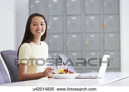 Woman Working In Design Studio Having Lunch At Desk View Large Photo Image Stock Image - Woman Working In Design Studio Having Lunch At Desk. Fotosearch