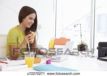 Woman Working In Design Studio Having Lunch At Desk View Large Photo Image Stock Image - Woman Working In Design Studio Having Lunch At Desk. Fotosearch