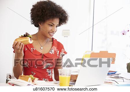 Woman Working In Design Studio Having Lunch At Desk View Large Photo Image Stock Image - Woman Working In Design Studio Having Lunch At Desk. Fotosearch