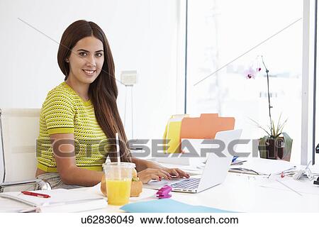 Woman Working In Design Studio Having Lunch At Desk View Large Photo Image Stock Photo - Woman Working In Design Studio Having Lunch At Desk. Fotosearch