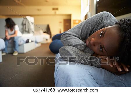 Stock Photo - Women Lying On Beds In Homeless Shelter. Fotosearch