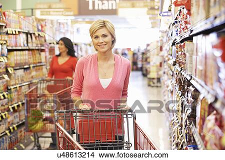 Picture - Women shopping in supermarket. Fotosearch
