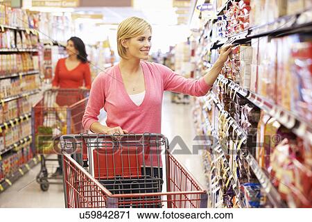 Women shopping in supermarket View Large Photo Image Stock Image - Women shopping in supermarket. Fotosearch