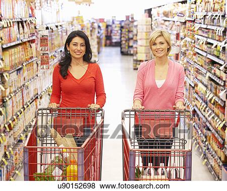 Stock Photo - Women shopping in supermarket. Fotosearch