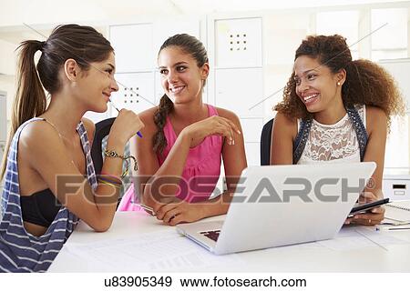 Women Using Laptop In Modern Office Of Start Up Business View Large Photo Image Stock Photo - Women Using Laptop In Modern Office Of Start Up Business. Fotosearch