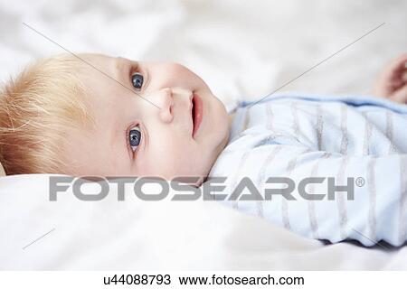 Young Baby Boy Lying In Bed View Large Photo Image Stock Image - Young Baby Boy Lying In Bed. Fotosearch
