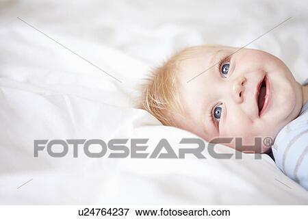 Young Baby Boy Lying In Bed View Large Photo Image Stock Photo - Young Baby Boy Lying In Bed. Fotosearch