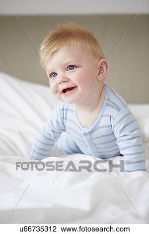 Young Baby Boy Playing In Bed View Large Photo Image Stock Image - Young Baby Boy Playing In Bed. Fotosearch