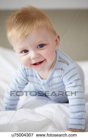 Young Baby Boy Playing In Bed View Large Photo Image Stock Photo - Young Baby Boy Playing In Bed. Fotosearch