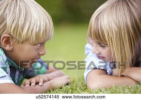 Young boy and girl outdoors View Large Photo Image Stock Photography - Young boy and girl outdoors. Fotosearch