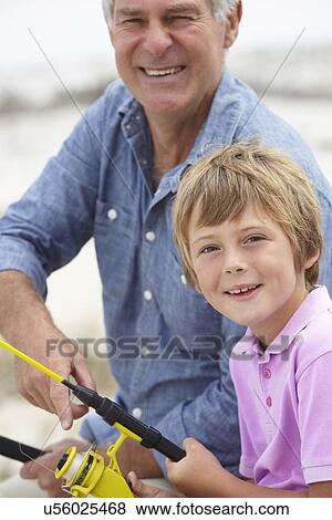 Young boy fishing with grandfather View Large Photo Image Stock Photo - Young boy fishing with grandfather. Fotosearch