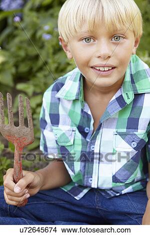 Picture - Young boy gardening. Fotosearch