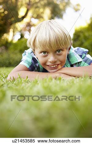 Stock Photography - Young boy outdoors. Fotosearch