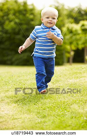 Young Boy Playing In Summer Garden View Large Photo Image Stock Image - Young Boy Playing In Summer Garden. Fotosearch