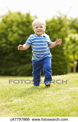 Young Boy Playing In Summer Garden View Large Photo Image Stock Photograph - Young Boy Playing In Summer Garden. Fotosearch