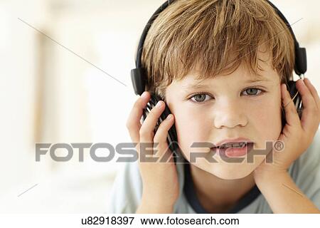 Young boy wearing headphones View Large Photo Image Stock Photo - Young boy wearing headphones. Fotosearch
