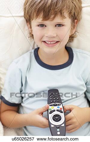 Young boy with remote control View Large Photo Image Stock Photo - Young boy with remote control. Fotosearch