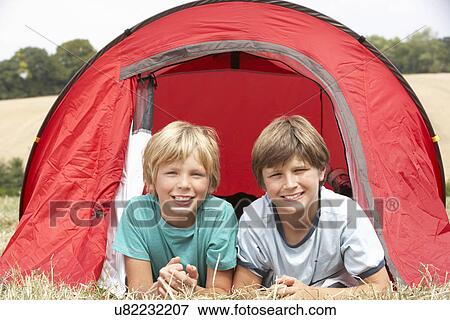 Stock Photo - Young boys on camping trip. Fotosearch