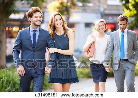 Young Business Couples Walking Through City Park Together View Large Photo Image Stock Image - Young Business Couples Walking Through City Park Together. Fotosearch