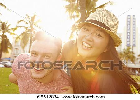 Picture - Young Couple Having Fun In Park Together. Fotosearch