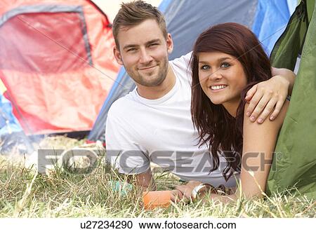 Stock Image - Young couple on camping trip. Fotosearch