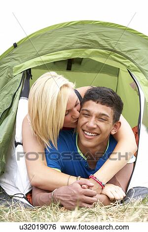 Young couple on camping trip View Large Photo Image Stock Photograph - Young couple on camping trip. Fotosearch