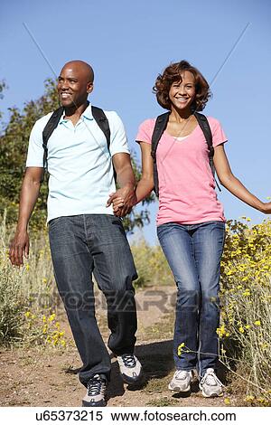 Young couple on country hike View Large Photo Image Stock Photography - Young couple on country hike. Fotosearch