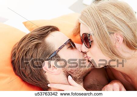 Young Couple On Holiday Relaxing By Swimming Pool View Large Photo Image Stock Image - Young Couple On Holiday Relaxing By Swimming Pool. Fotosearch
