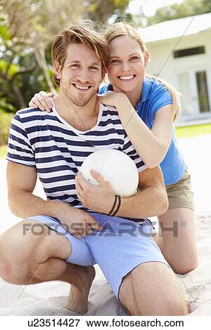Young Couple Playing Volleyball Match View Large Photo Image Stock Photo - Young Couple Playing Volleyball Match. Fotosearch