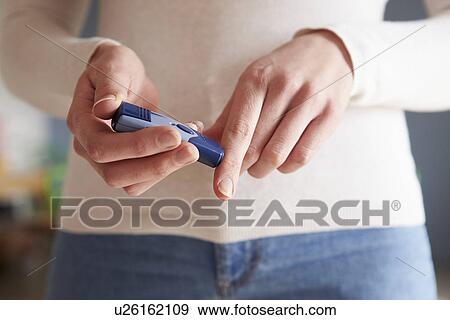 Young Couple Sitting On Sofa Using Digital Tablet View Large Photo Image Stock Photo - Young Couple Sitting On Sofa Using Digital Tablet. Fotosearch