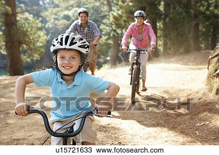 Young family on country bike ride View Large Photo Image Stock Image - Young family on country bike ride. Fotosearch