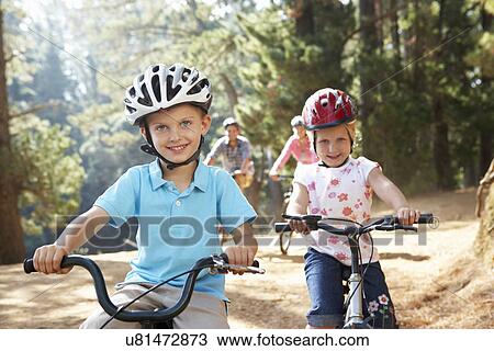 Young family on country bike ride View Large Photo Image Stock Image - Young family on country bike ride. Fotosearch