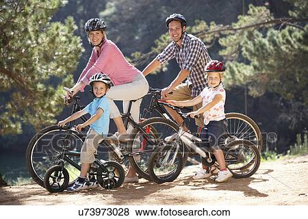 Young family on country bike ride View Large Photo Image Stock Photo - Young family on country bike ride. Fotosearch