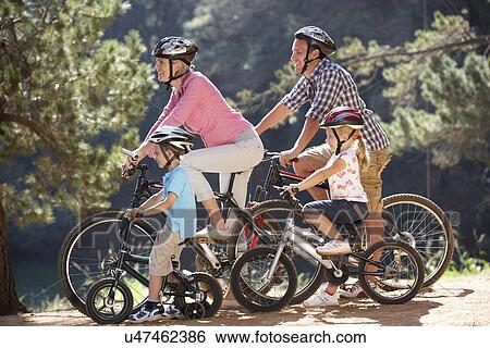 Young family on country bike ride View Large Photo Image Stock Photograph - Young family on country bike ride. Fotosearch