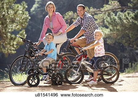 Stock Photograph - Young family on country bike ride. Fotosearch